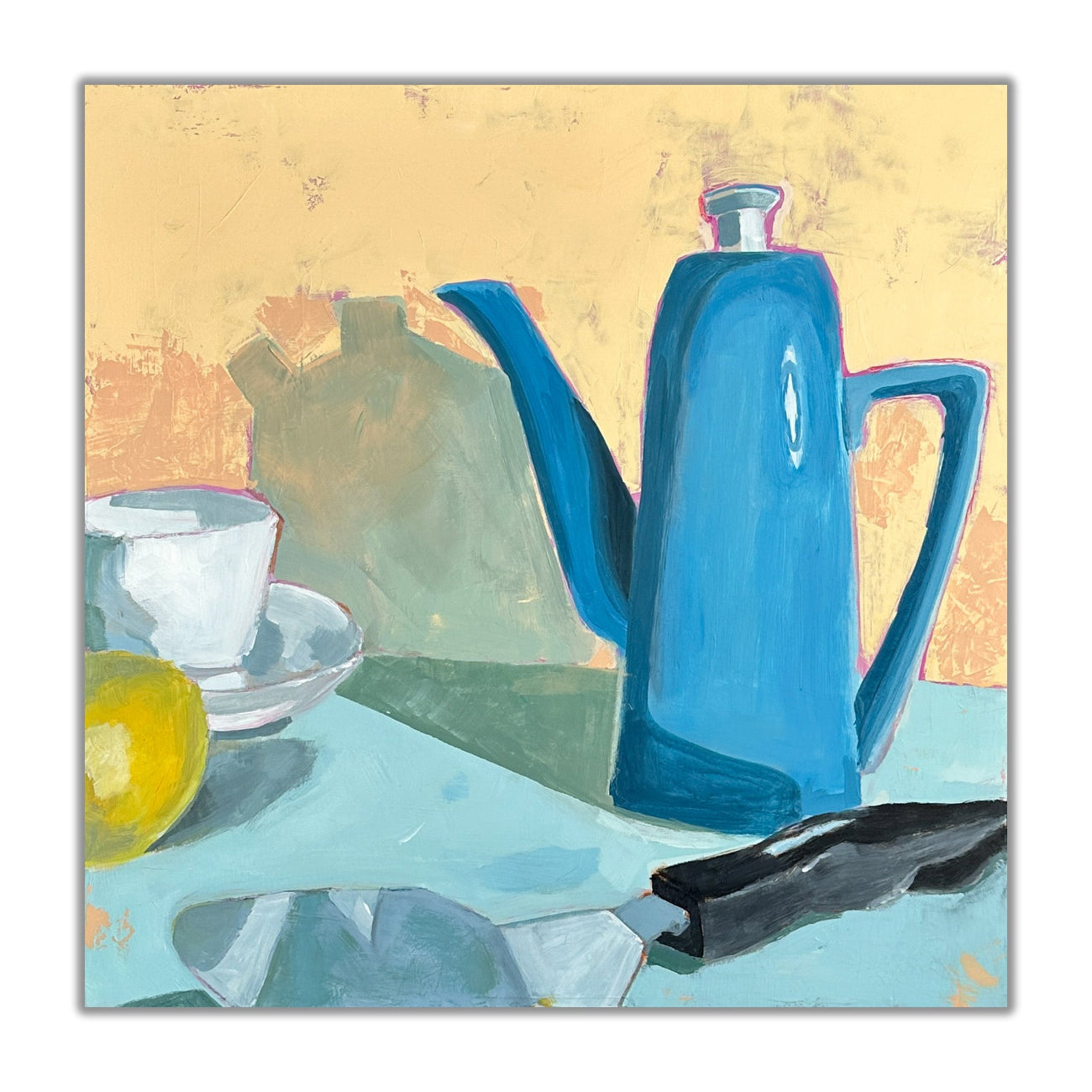 still life in bold colors of blues and peach, blue teapot, white teacup, yellow lemon and a pie knife.