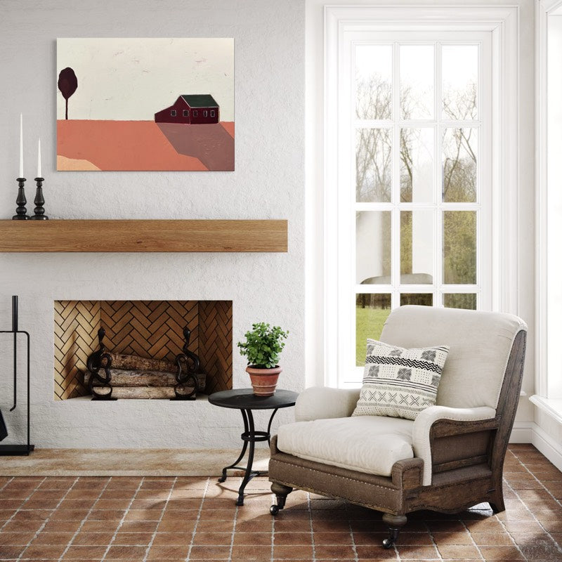 Room with white walls and fireplace with a landscape painting hung above wood mantle. 