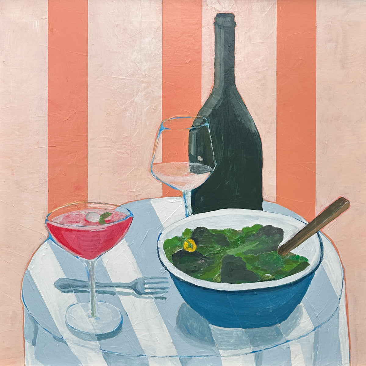 A still life painting of a dining table scene with a blue bowl of green salad, a pink cocktail in a coupe glass, a wine glass, and a dark wine bottle against a pink and white striped background.