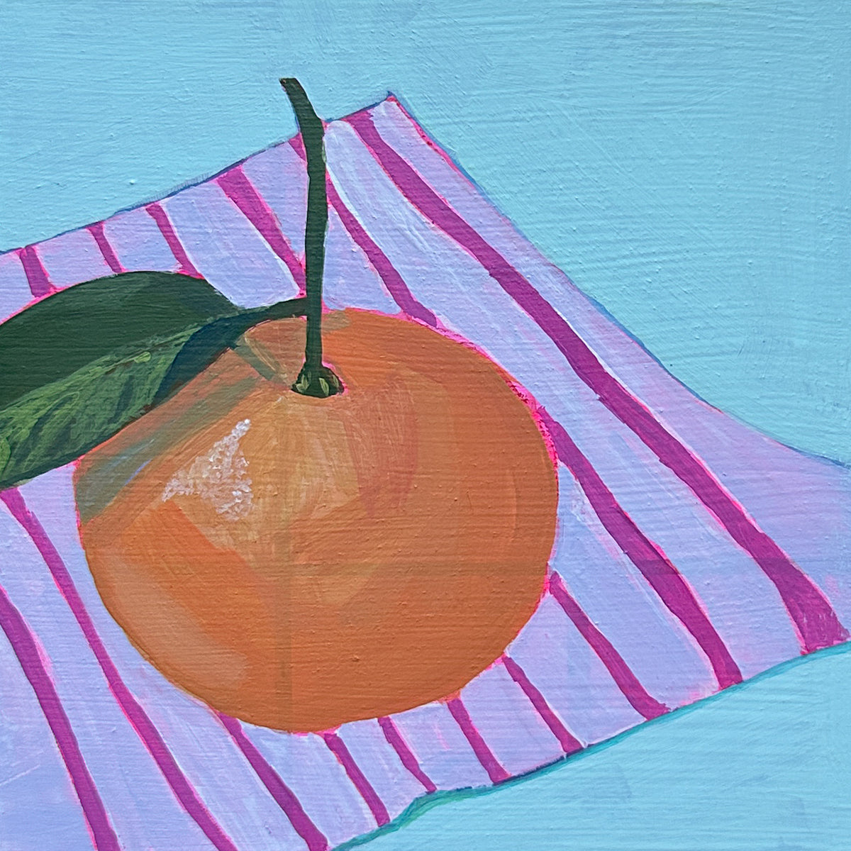 painting of a clementine orange with stem and leaf sitting on pink striped napkin. 