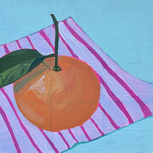 painting of a clementine orange with stem and leaf sitting on pink striped napkin. 